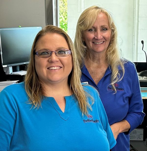 picture of two employees working at the Lake Camelot branch