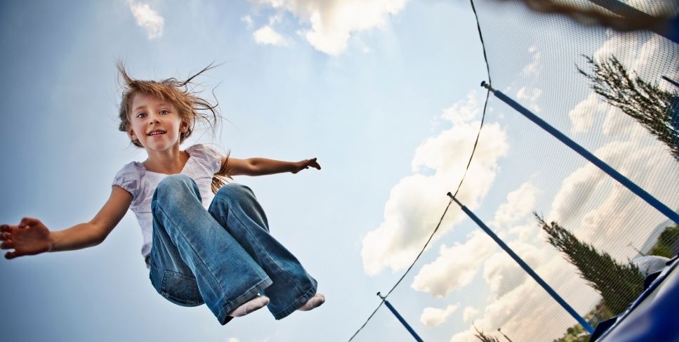 girl jumping on trampoline