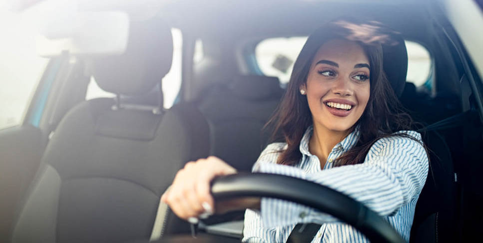 Woman Driving Car information about the auto loan options available at Better Banks